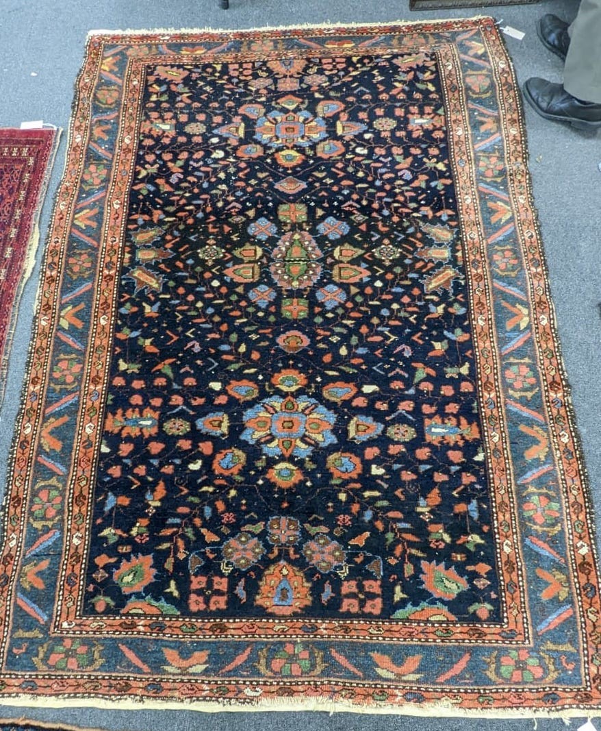An antique Malaya rug, 210 x 148cm